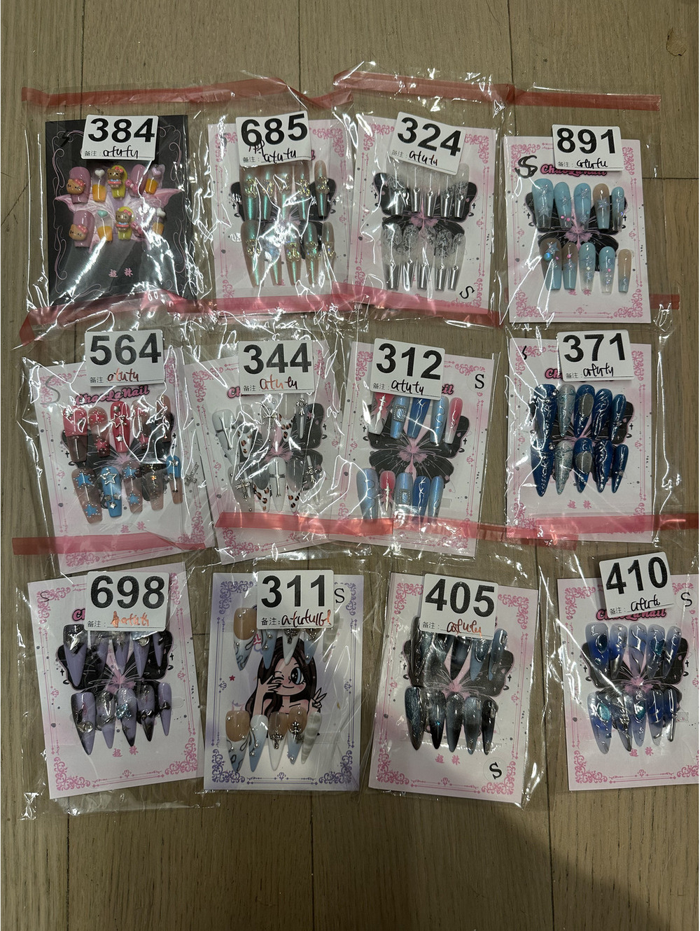 Assorted Handmade and Press-On Nail Art